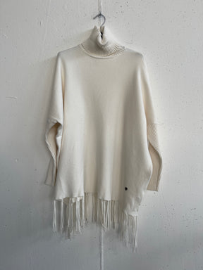 Pull collo alto con frange