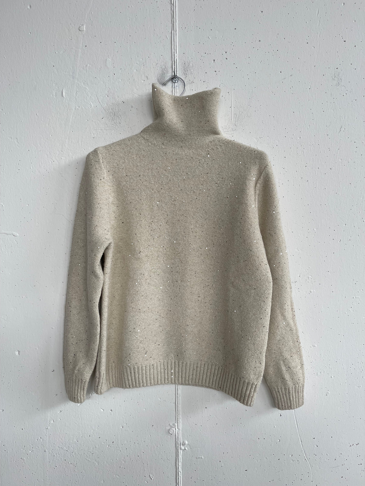 Pull metallico collo alto