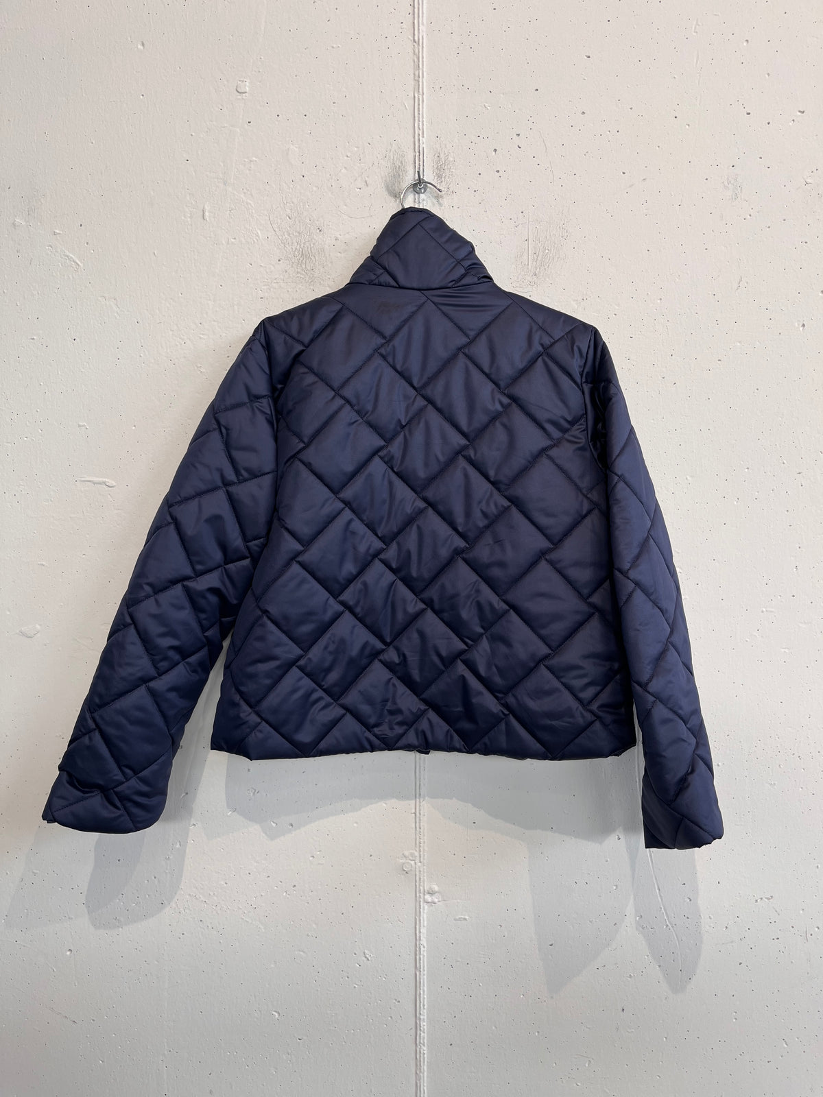 Piumino trapuntato con taglio a scotola
