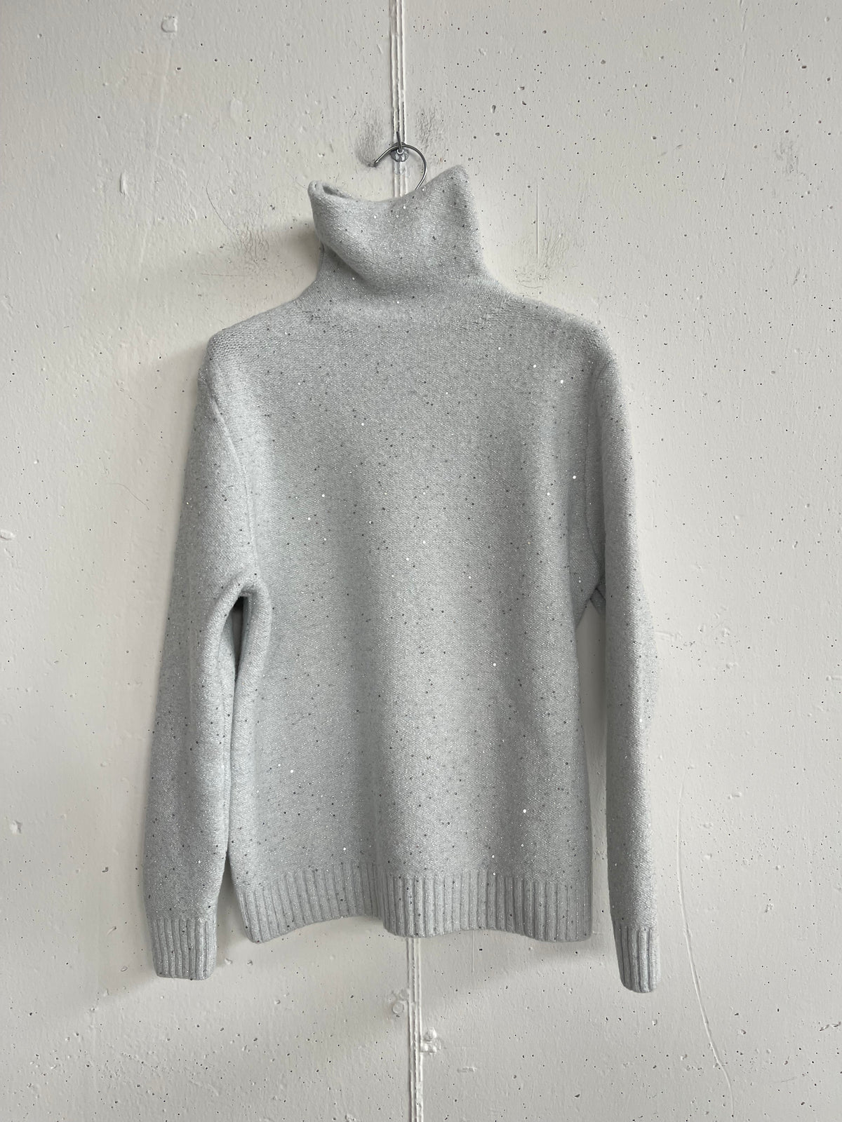 Pull metallico collo alto