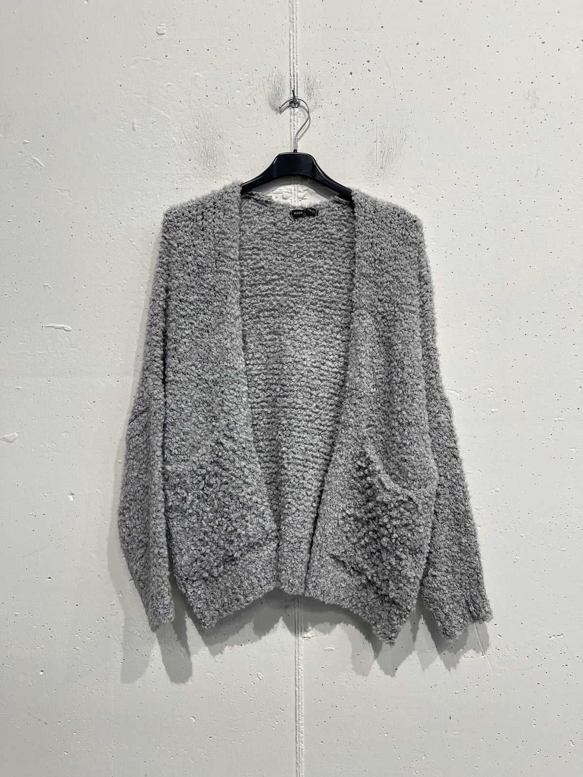 Cardigan bouclè con tasche