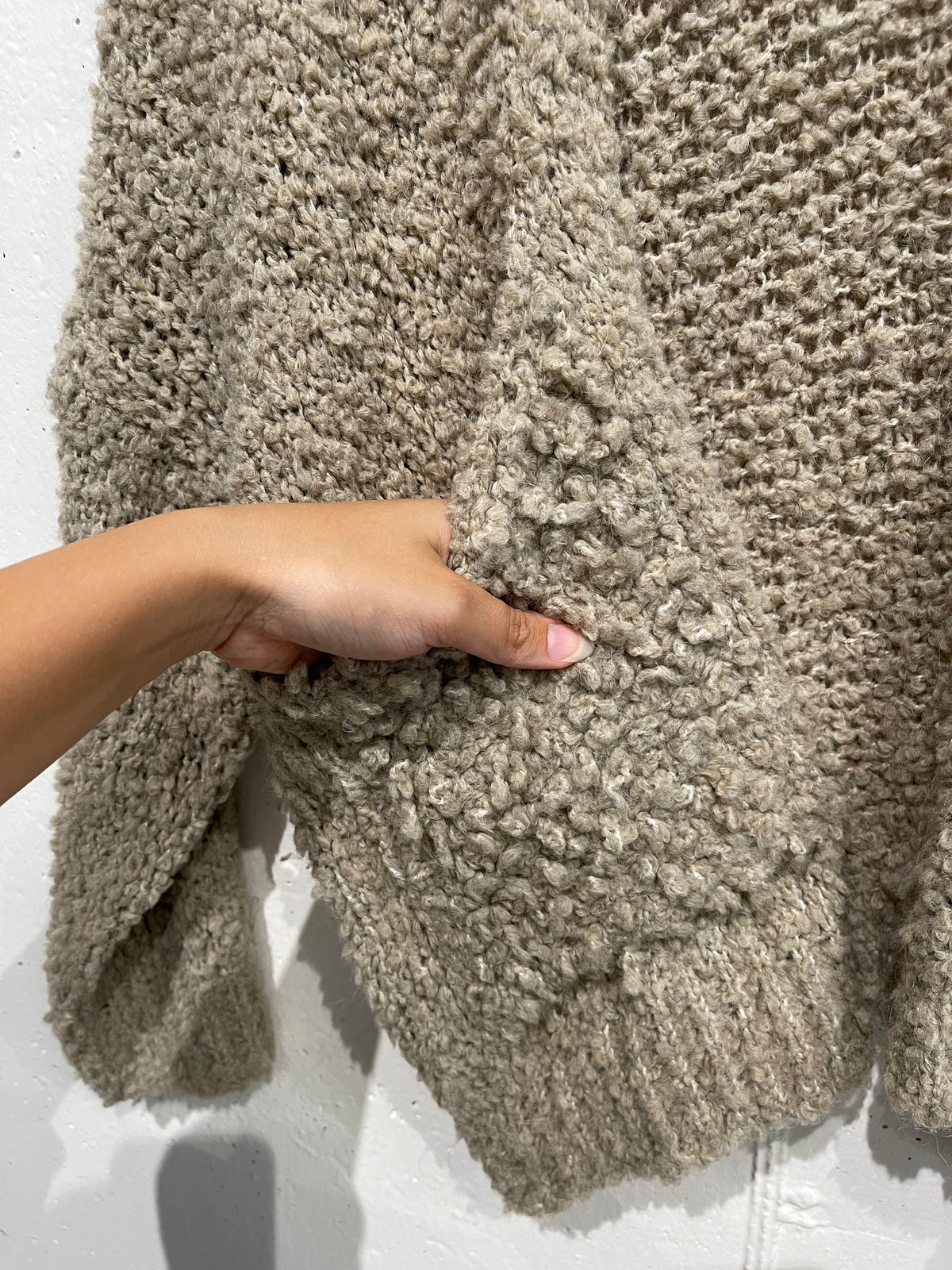 Cardigan bouclè con tasche