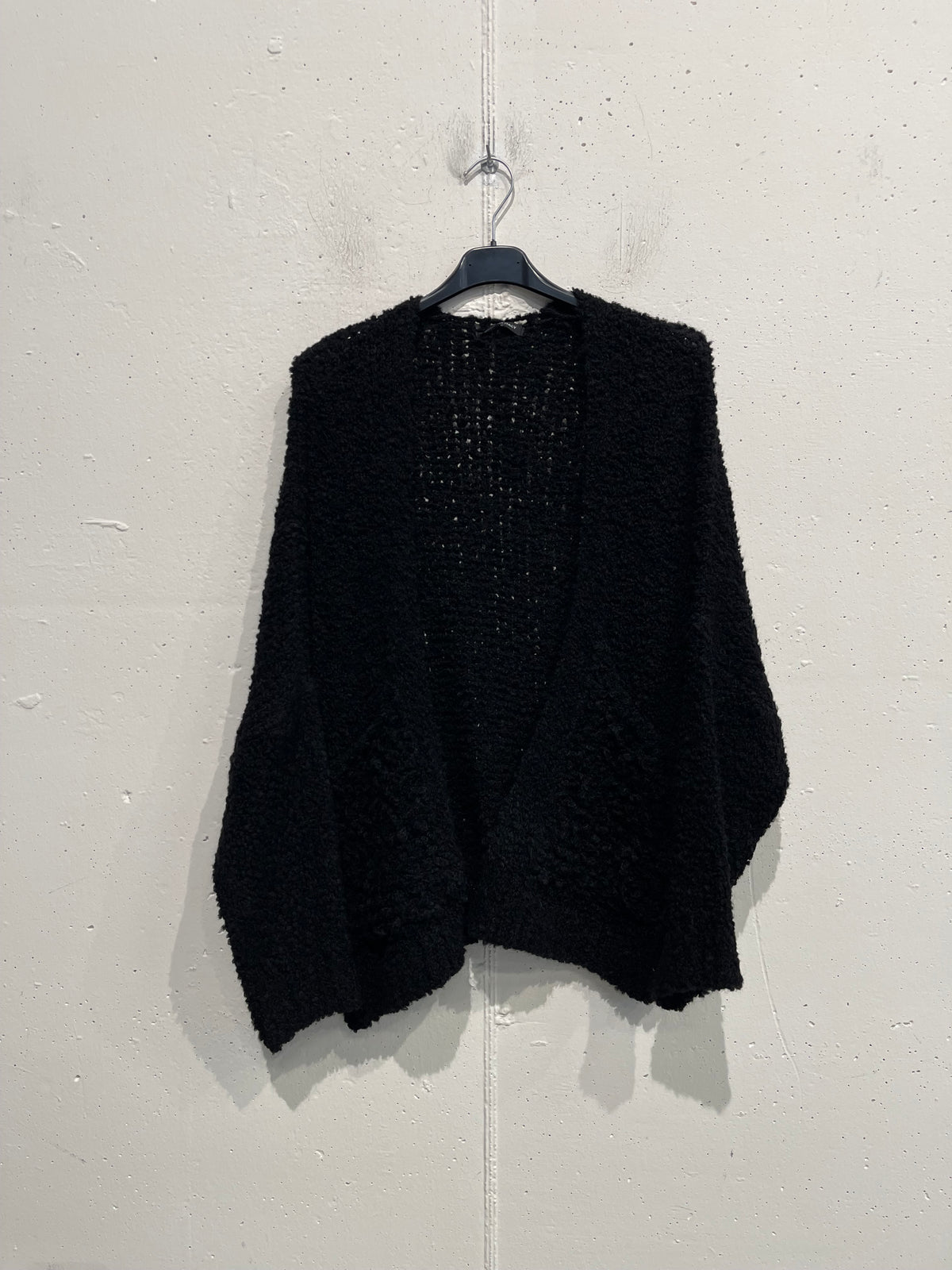 Cardigan bouclè con tasche
