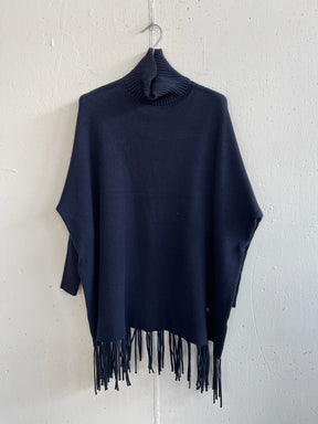 Pull collo alto con frange